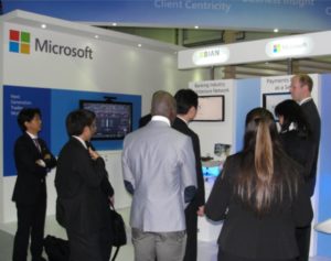 Business professionals at Microsoft's booth at Sibos 2013